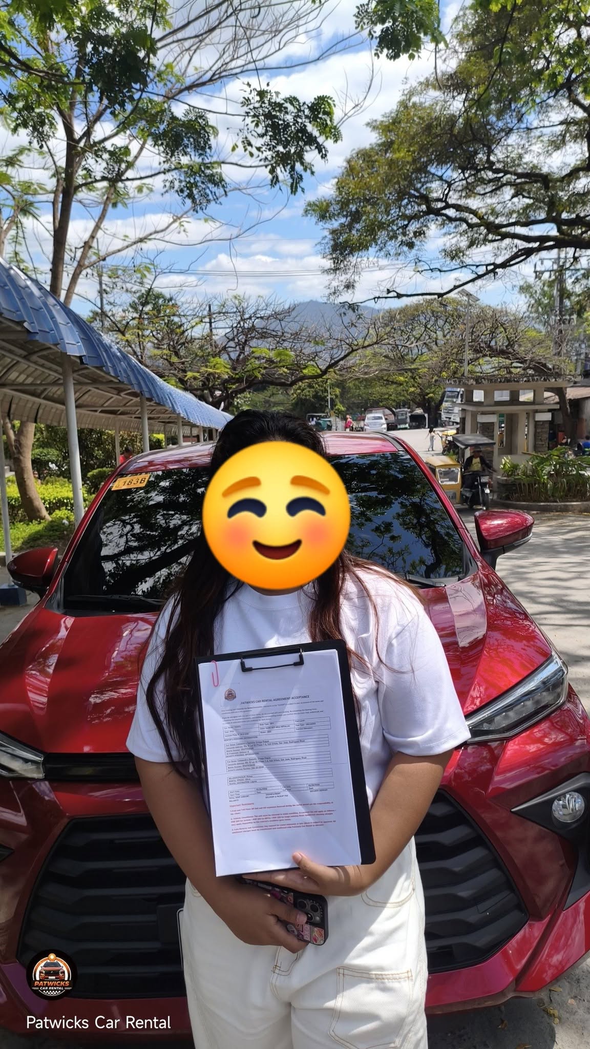 Happy customer with rented vehicle